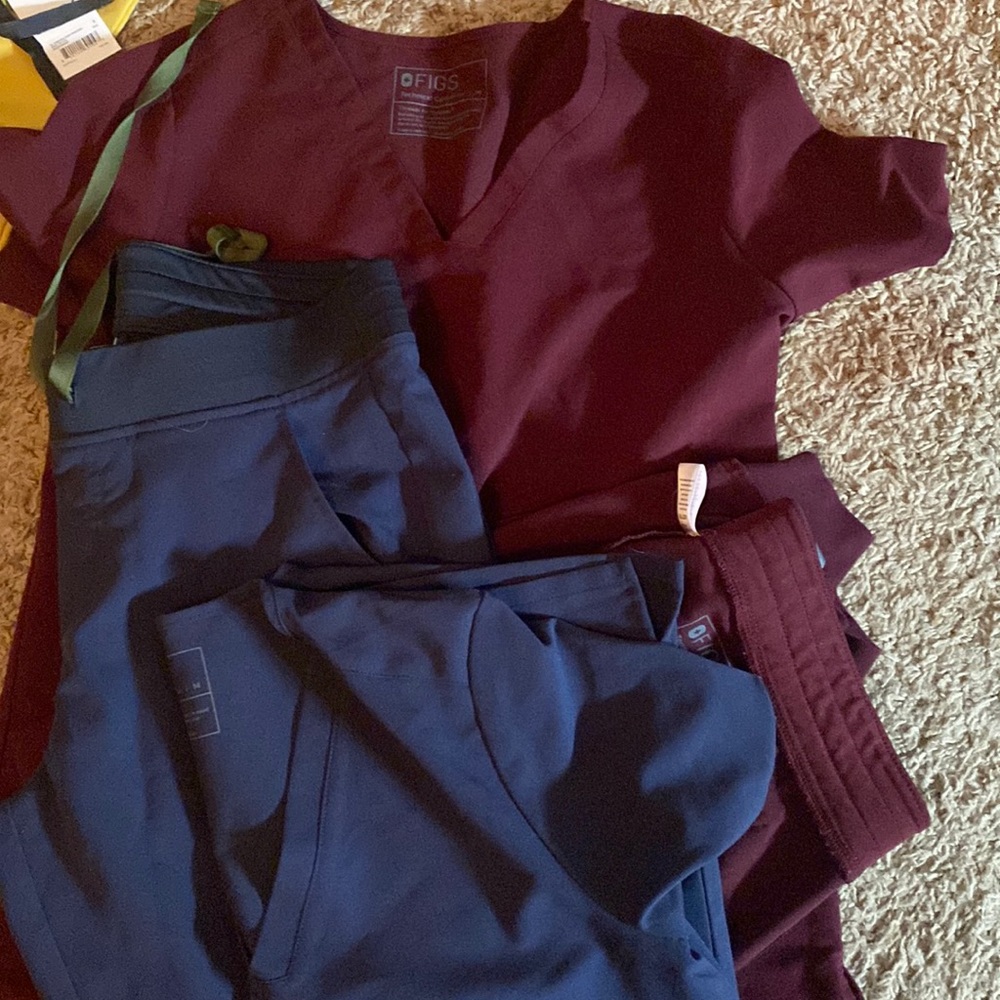 Two sets figs scrubs. Worn a few times. Like new. Joggers and 3 pocket top